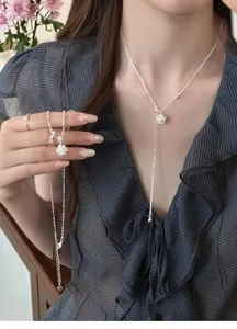Elegant zircon flower tassel necklace on model with refined Korean ins style aesthetic