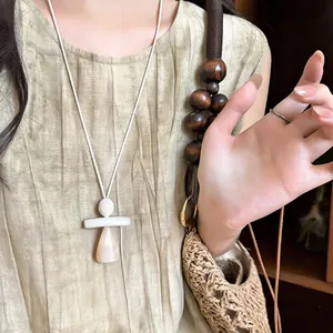 Minimalist resin geometric pendant necklace with white and pink drops on white cord