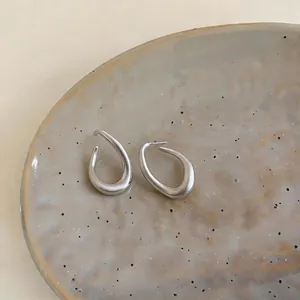 Elegant matte silver twisted oval hoop earrings in minimalist Korean style jewelry