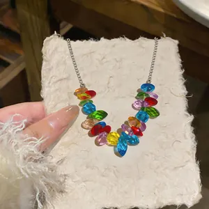 Detailed macro view of colorful marquise crystal beads on a silver stainless steel necklace