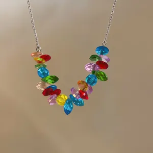 Close-up of vibrant multi-colored faceted beads on a silver stainless steel chain