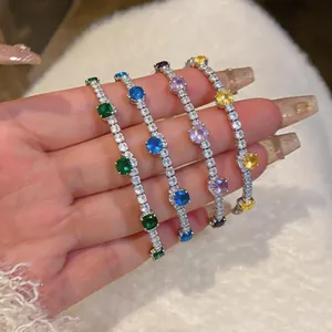 Close-up detail of colorful dopamine zircon bracelets with sparkling round cut stones.