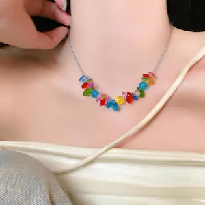 Macro view of a colorful beaded necklace on a silver stainless steel chain for women