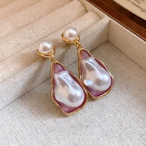 Elegant vintage style irregular baroque pearl drop earrings with purple enamel inlay