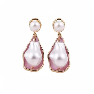 Vintage baroque pearl drop earrings with pink enamel frame and gold-toned finish