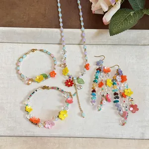 Colorful resin flower jewelry set with beaded necklace, bracelets and earrings detail