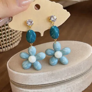 Elegant fresh blue resin flower stud earrings featuring clear zircon and dark blue marble beads