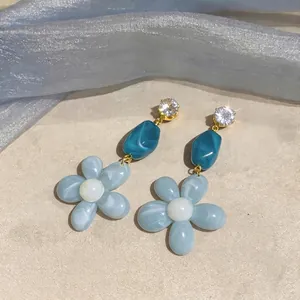 Handcrafted blue resin flower dangle earrings with sparkling zircon studs and silver needles