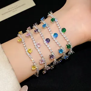 Elegant silver tennis bracelets with colorful round zircon charms on a wrist.