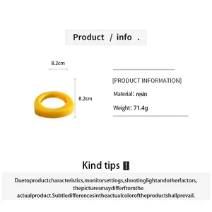 Yellow resin irregular geometric bangle detail with 8.2cm diameter and 71.4g weight