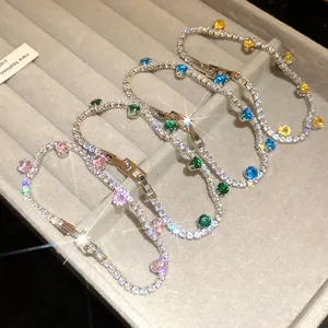 Detailed view of luxury zircon tennis bracelets in pink, green, blue and yellow colors