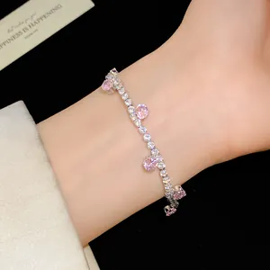 Elegant detail view of a silver-toned tennis bracelet with pink and white cubic zirconia.