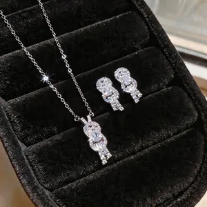 Elegant zircon-studded horseshoe necklace and earring set in a jewelry box.