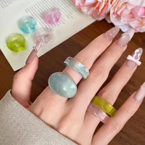Minimalist colorful translucent resin ring set with irregular round and flat band designs