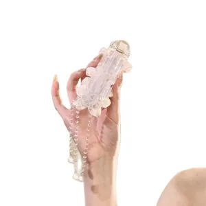 Elegant pink flower hair clip featuring long pearl tassels and a clear resin hairpin base