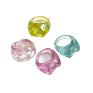 Set of four colorful chunky resin rings in irregular round shapes with a translucent finish