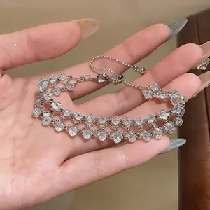 Elegant hand-woven openwork bracelet featuring clear faceted beads and silver chain