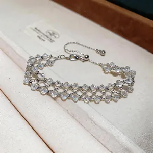 Detailed view of a handmade silver mesh bracelet with clear crystal beads and adjustable clasp.