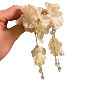 Handmade jasmine flower petal tassel earrings for elegant seaside vacation style