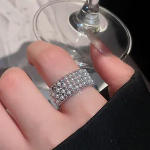 Close-up of a luxury French style ring with multi-row pearls and sparkling zircon stones