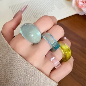 Close-up of colorful resin rings in four vibrant dopamine-inspired shades.