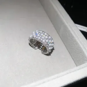 Macro view of a luxury French style open ring featuring shiny zircons and white pearls