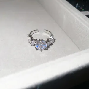 Detailed macro shot of a sparkling cubic zirconia flower open ring in a jewelry box