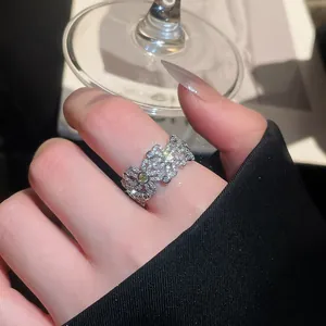 Macro view of a vintage silver-plated floral zircon open ring with intricate crystal details