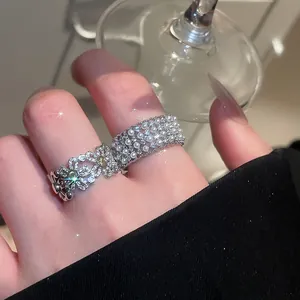 Close-up of vintage French style rings with pearls and zircon flower details