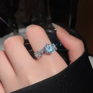 Close-up detail of a French vintage sparkling zircon flower open ring on index finger