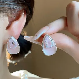 Elegant pink teardrop zircon stud earrings with silver needle and enamel finish design
