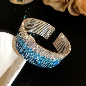 Close-up of a multi-layer gradient blue rhinestone elastic cuff bracelet