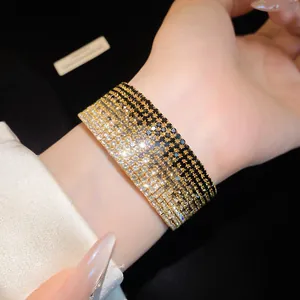 Detailed view of an elegant multi-layer gradient rhinestone stretch bracelet on a wrist