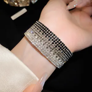 Detailed close-up showing a multi-layer rhinestone gradient elastic bracelet on a wrist