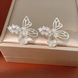 Elegant silver butterfly stud earrings with teardrop zircons shown on a premium jewelry box