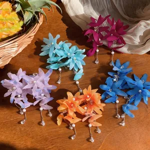 Elegant fabric flower tassel earrings with pearls and crystals in five vibrant colors