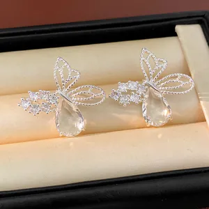 Detailed view of elegant silver butterfly stud earrings with sparkling teardrop zircon