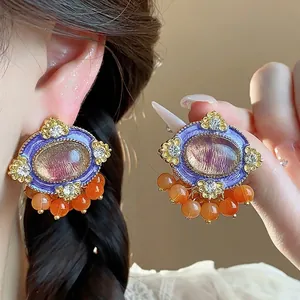 Vintage purple resin oval stud earrings with orange beads and sparkling rhinestones