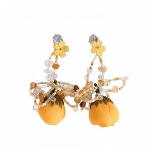 Elegant yellow fabric rose tassel dangle earrings with gold flowers and crystals