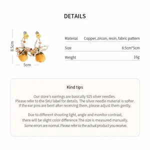 Detailed size and material information for handmade yellow flower tassel earrings