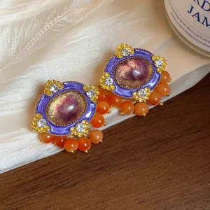 Vintage purple and gold enamel earrings with orange beads and rhinestone details