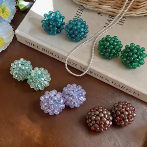 Colorful handmade glass bead flower cluster earrings in various vibrant shades