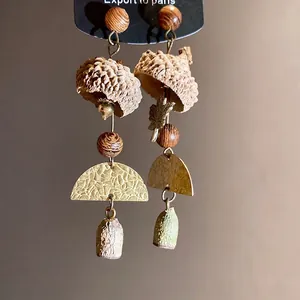 Vintage forest style long earrings featuring natural eucalyptus fruit and wood beads.