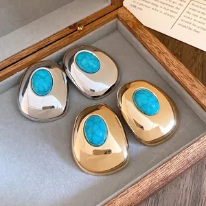 Vintage oval stud earrings with turquoise resin stone and silver needles