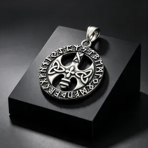 Detail shot of vintage Viking Celtic cross pendant with Norse rune engravings