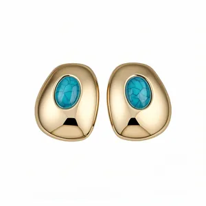 Vintage gold-tone oval stud earrings featuring turquoise-colored resin stones