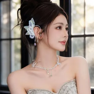 Elegant lace butterfly crystal ear cuff and matching necklace shown on a female model