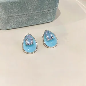 Elegant silver-needle teardrop earrings with sky blue enamel and clear zircon stones