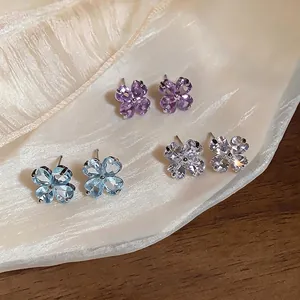 Elegant four-leaf clover stud earrings with sparkling colorful cubic zirconia gemstones
