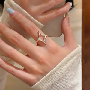 Luxurious 18k gold plated North Star ring with pavé zircon, shown on woman's hand.